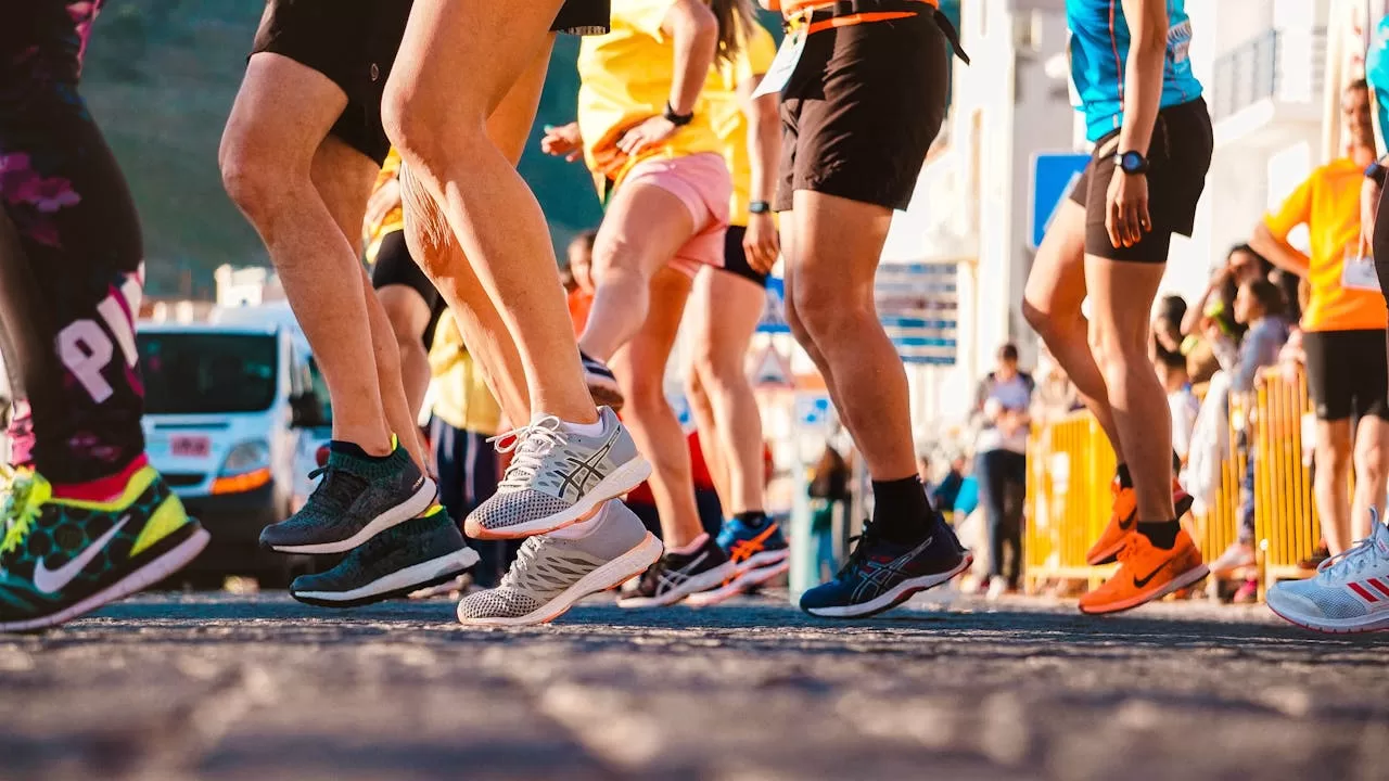 photo showing the legs of a group of runners